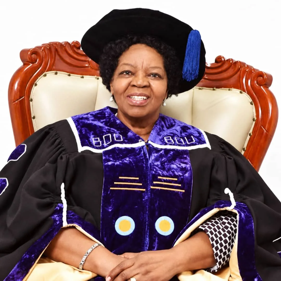 Professor Sheila Tlou seated in academic regalia.