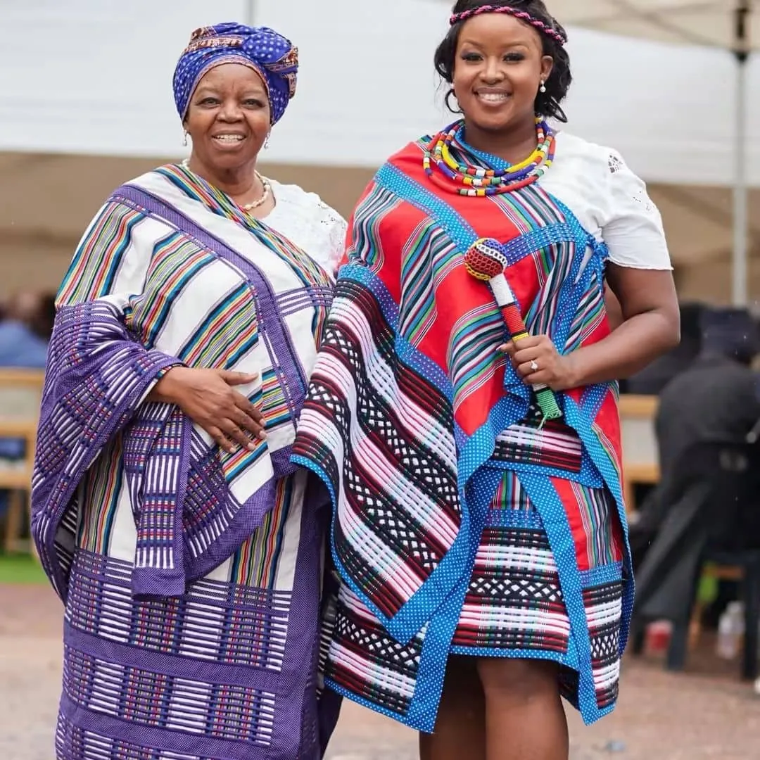 Professor Sheila Tlou and another woman in traditional dress.