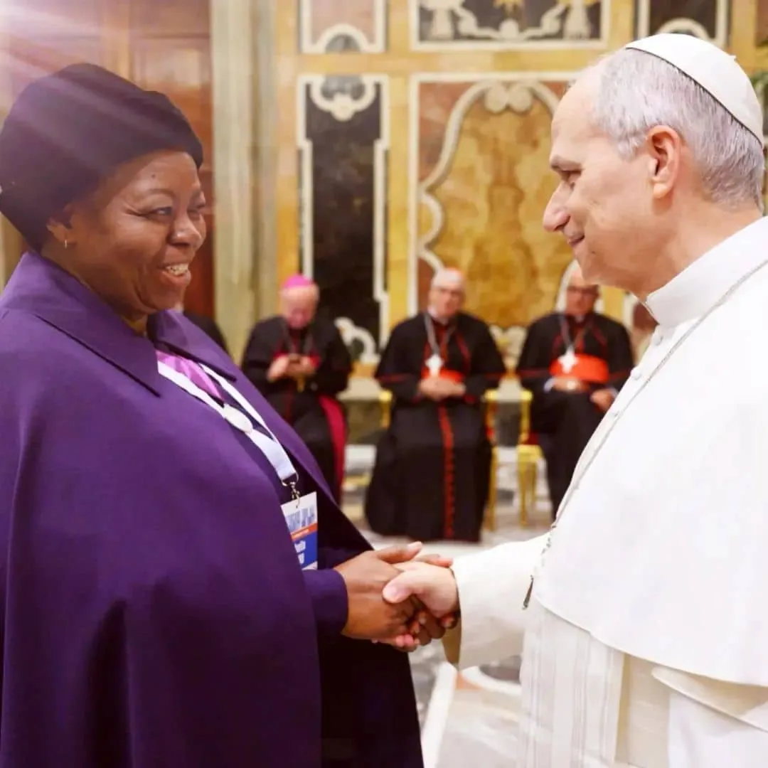 Professor Sheila Tlou greeting a religious leader.