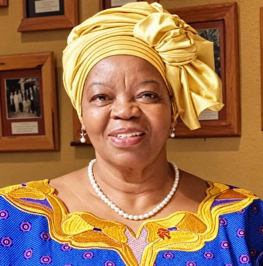 Portrait of Professor Sheila Tlou in a yellow headwrap.